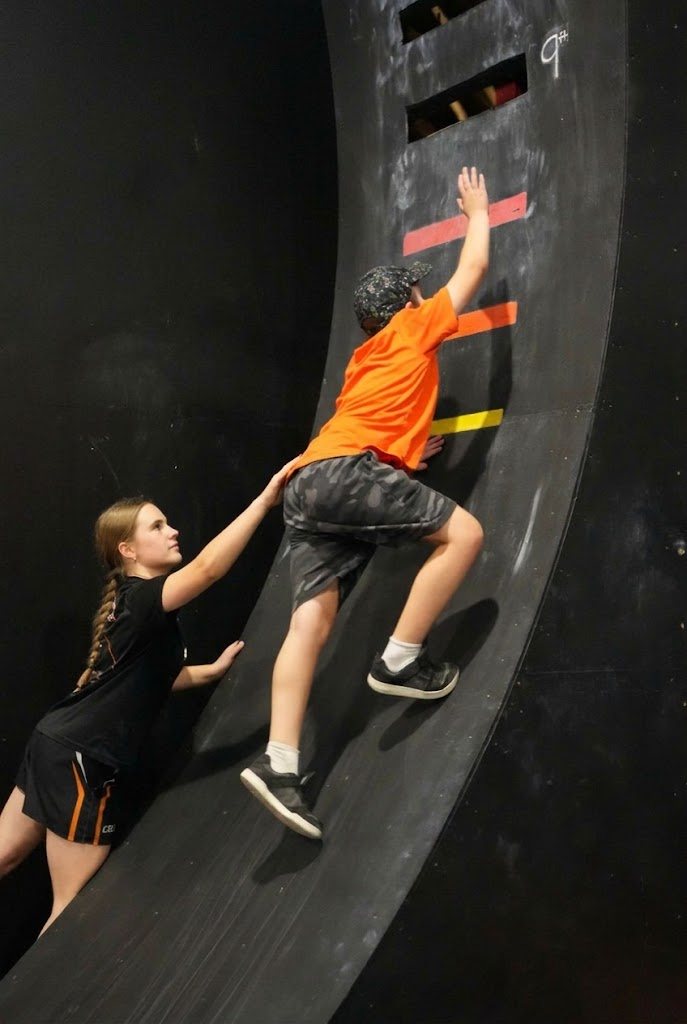 Kids climbing the ninja wheel at AWF Gosford