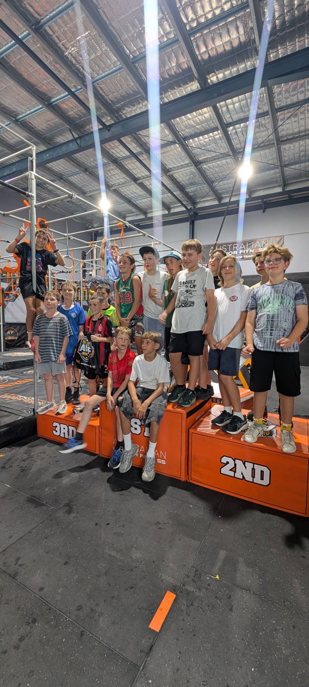 Birthday ninjas lined up on the AWF podium