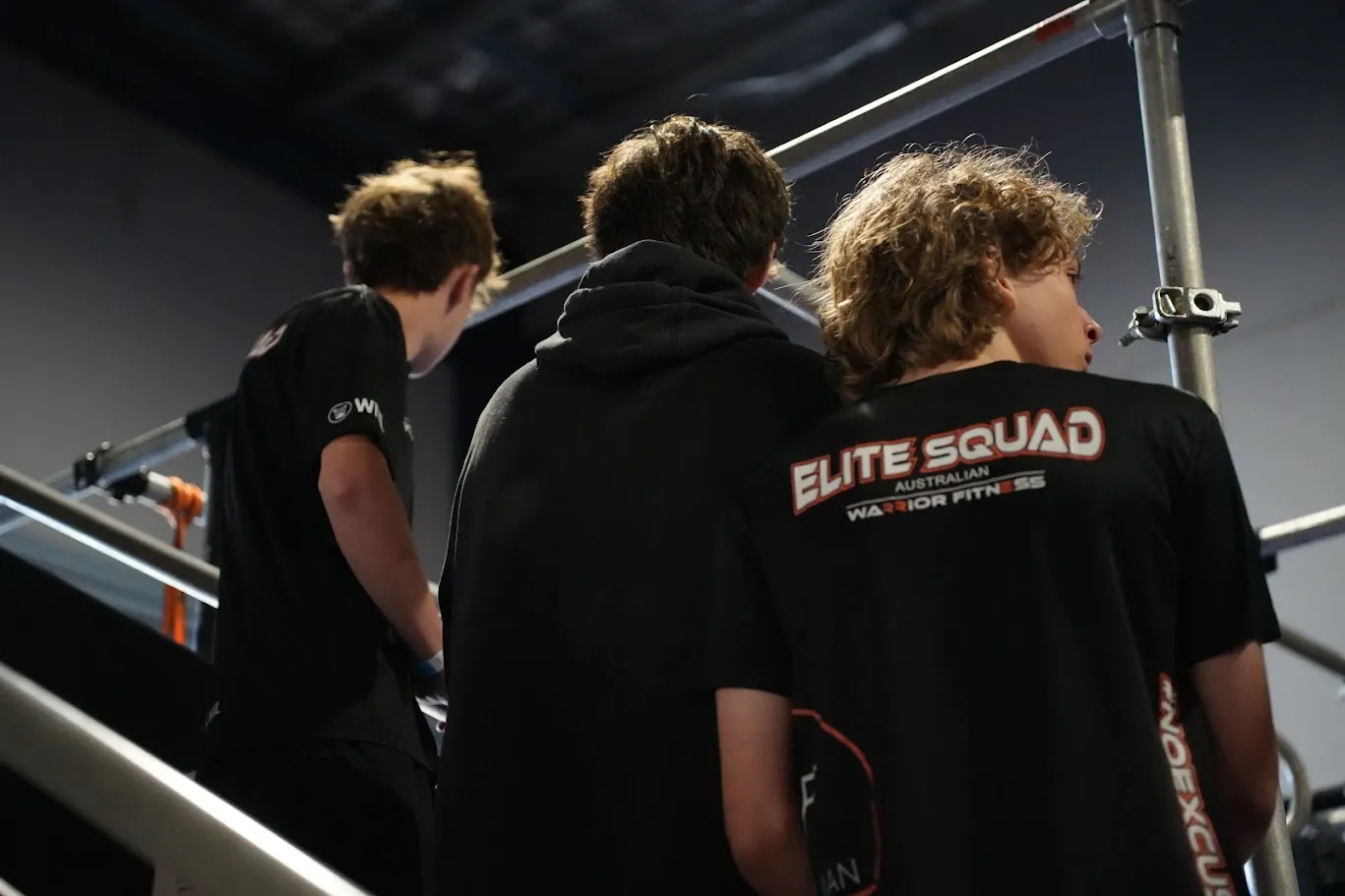 AWF Elite Squad athletes watching a run at the WNL qualifier