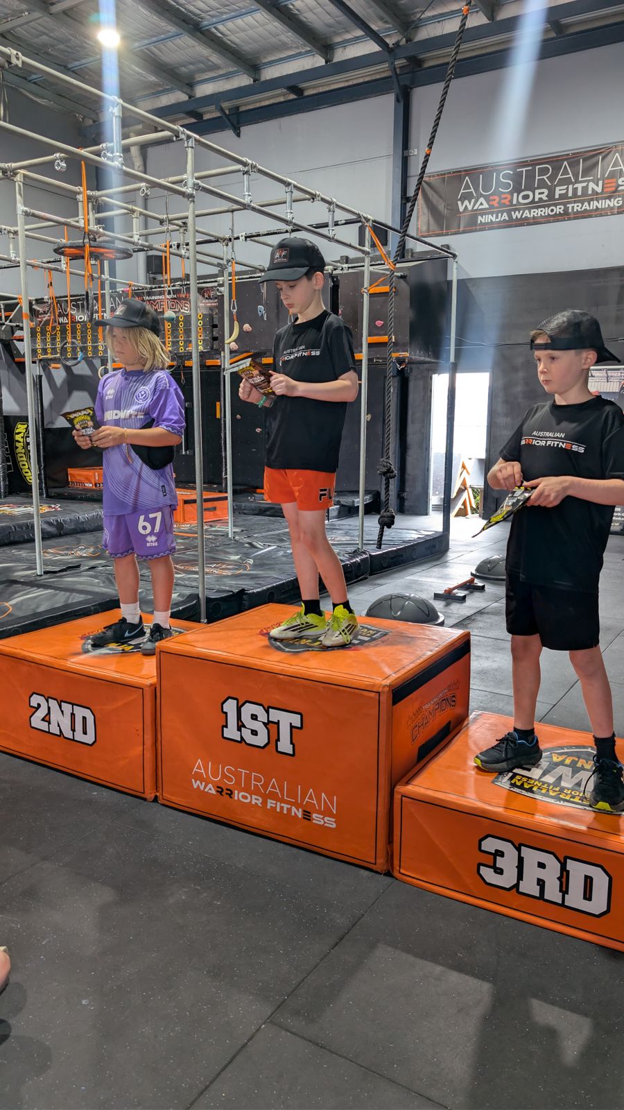 Kids on the winners podium at AWF Ninja Gosford