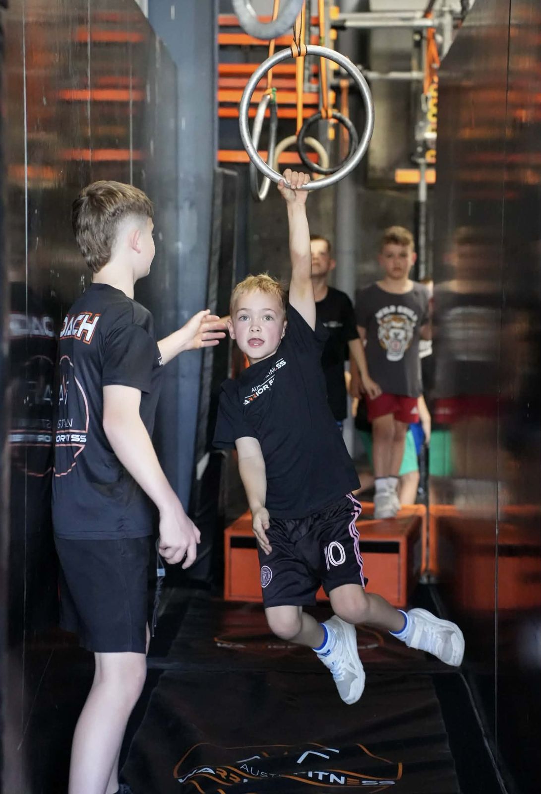 Kid climbing at AWF Ninja Gosford