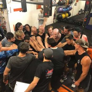 team at Australian Warrior Fitness doing a hands in
