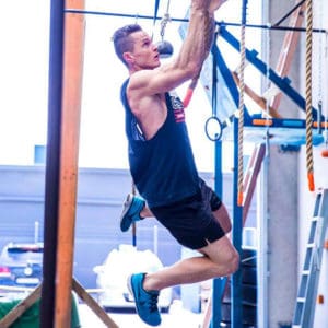 Cameron from Australian Warrior Fitness hanging from ropes